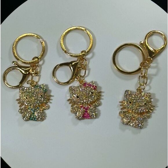 BAG CHARM Hello Kitty Gold Tone Crystal Hair Bow Bag Charm Keychain - Picture 4 of 6